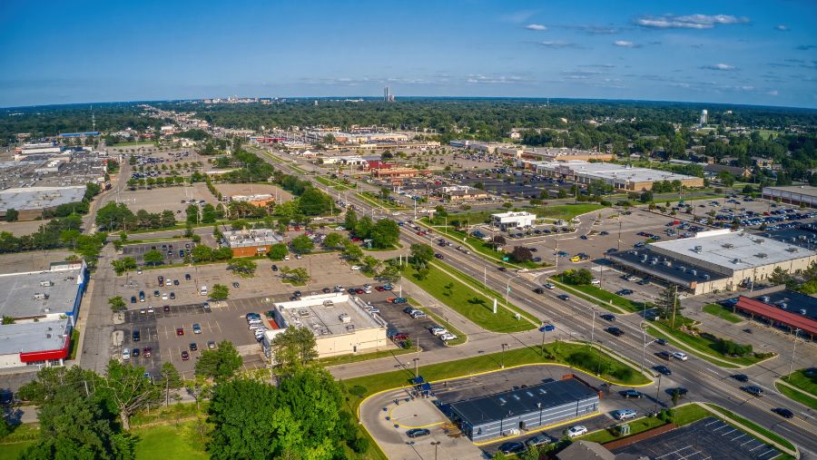 an aerial view of a city with lots of parking lots